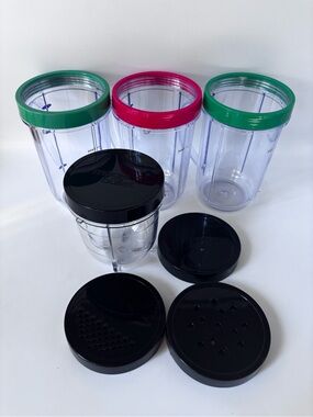 Unused Magic Bullet Accessories: 3 drinking cups with rings, 1 small jar, 4 lids